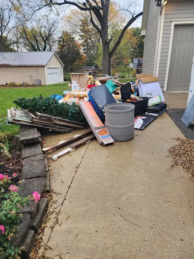 Dumpster being loaded with debris for 3 Yard Dumpster Rental in Alfred